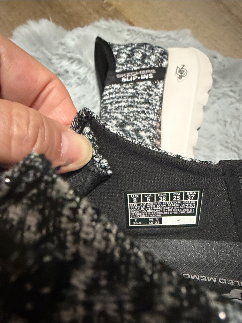 Skechers GO WALK Slip-ins featuring a black and white heathered knit upper. - Picture 7 of 8
